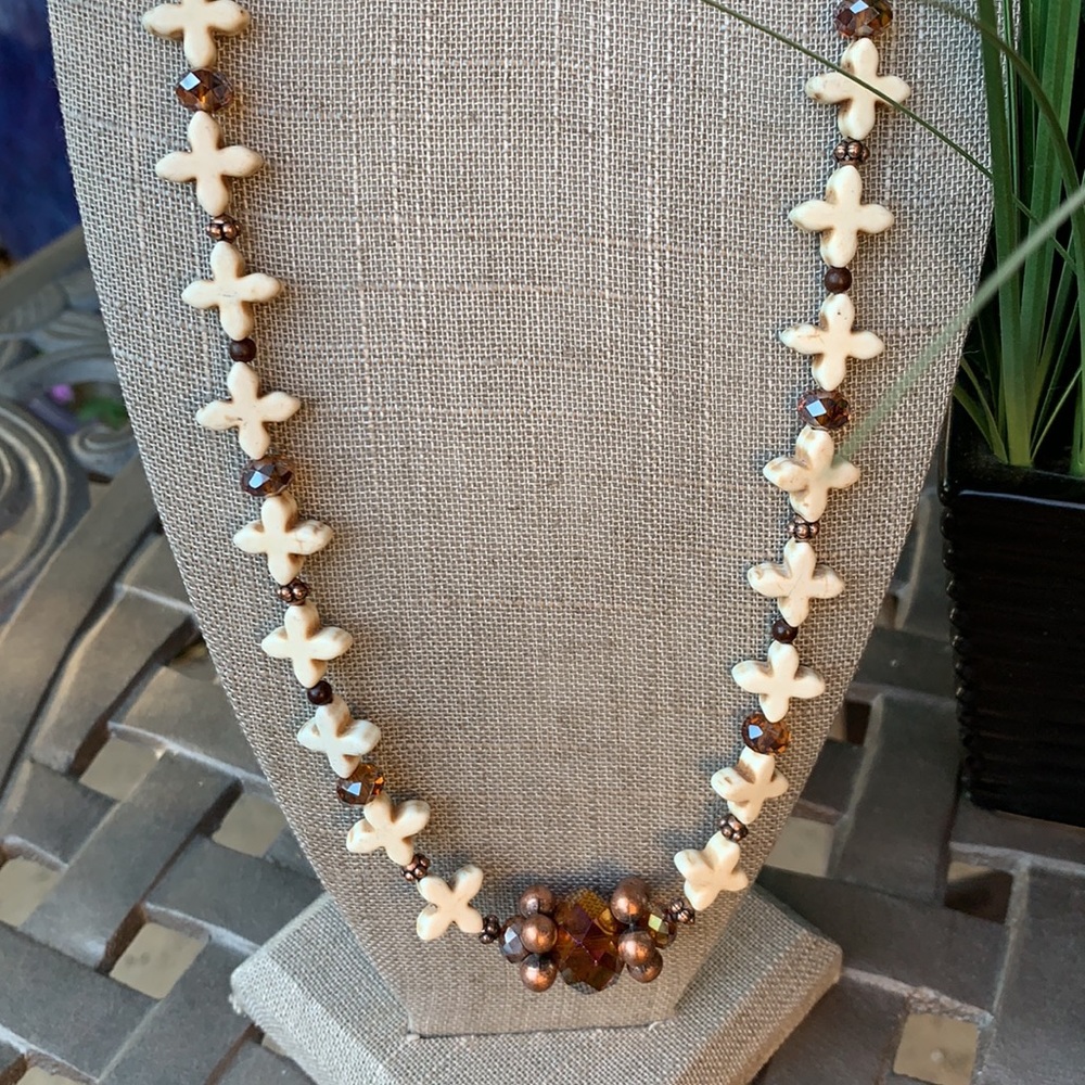 White and bronze toned cross necklace